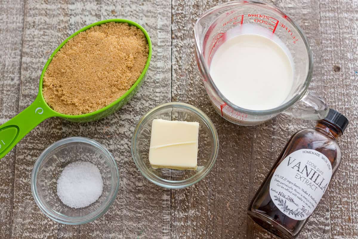 ingredients for dessert topping including brown sugar, butter, salt, half and half, and vanilla extract