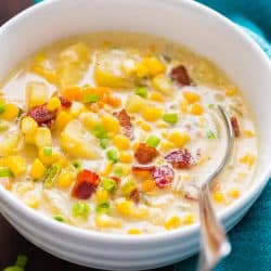 Bacon Corn Chowder in a white bowl garnished with bacon