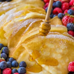 Crepe Recipe drizzled with honey and served with berries
