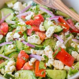 This Cucumber Tomato Feta Salad has simple ingredients that are a winning combination. Refreshing and flavorful! A new favorite cucumber tomato feta salad! | natashaskitchen.com