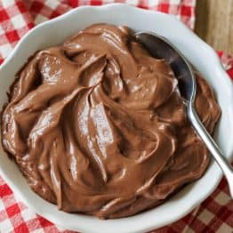 Hard Boiled Egg Chocolate Pudding served in a white dish with a red checkered napkin