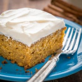 This Easy Pumpkin Cake is done in 4 steps (with frosting)! The moist, delicate crumb and marshmallow-like whipped cream cheese frosting is irresistible!