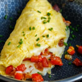 egg omelette in a blue dish for breakfast ideas