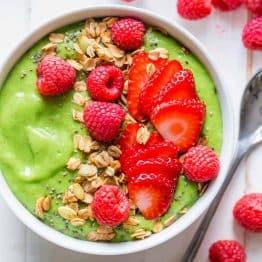 Green smoothie bowl garnished with berries