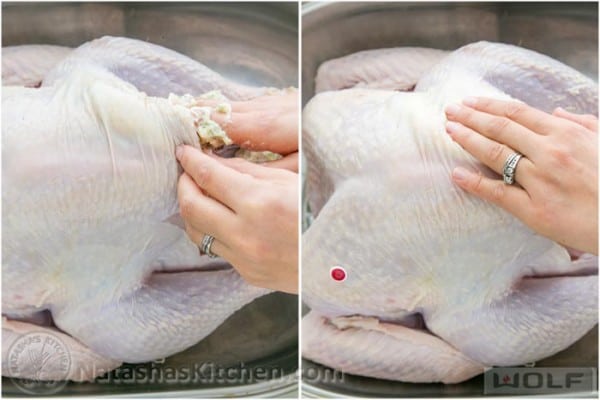Stuffing flavored butter under turkey skin and spreading it out
