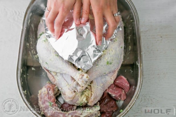 Measuring and shaping foil shield over the turkey breast 