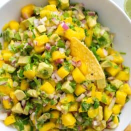 Mango salsa served with a tortilla chip