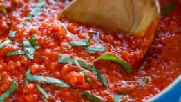 Marinara Sauce in Saucepan garnished with basil for Italian marinara