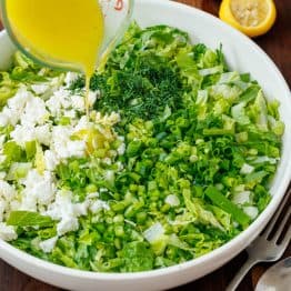 How to drizzle maroulosalata dressing over greens