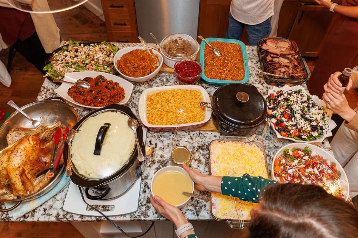 Natasha's Family Thanksgiving Food table showing variety of sides and main courses