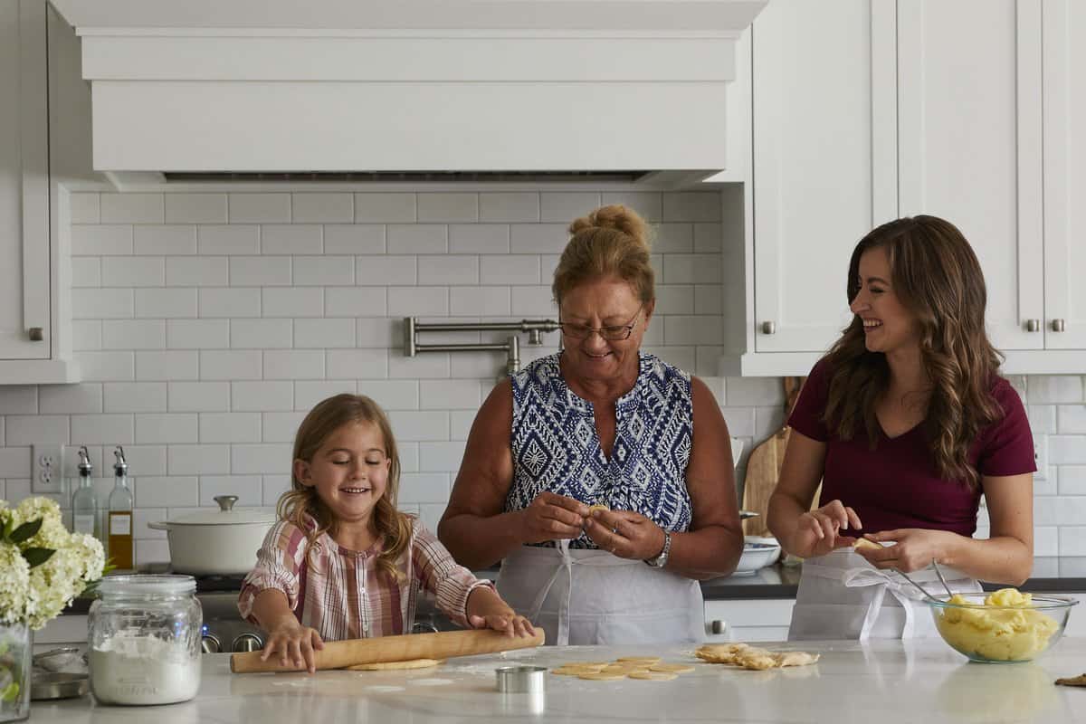 Natasha with mom and daughter making pierogi