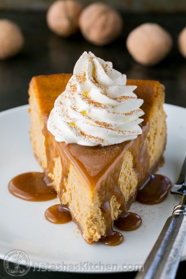 Homemade butterscotch sauce served over pumpkin cheesecake