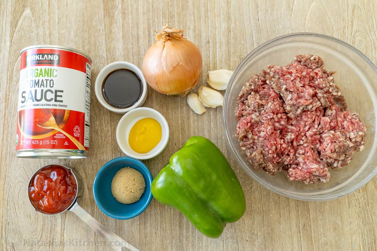 Ingredients for sloppy joes with ground beef, tomato sauce, bell pepper, onion and seasonings