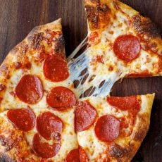 a slice of Homemade sourdough pizza dough recipe using active sourdough starter