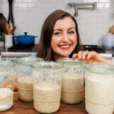Natasha with growing Sourdough Starters in jars