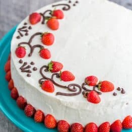This is THE Strawberry Cake!! It calls for 1 1/2 lbs of fresh strawberries & the whipped cream cheese frosting is simple & delicious. | natashaskitchen.com