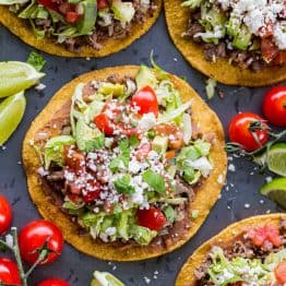 Tostadas assembled with lime wedges