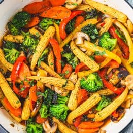 Vegetable stir fry in skillet with stir fry sauce